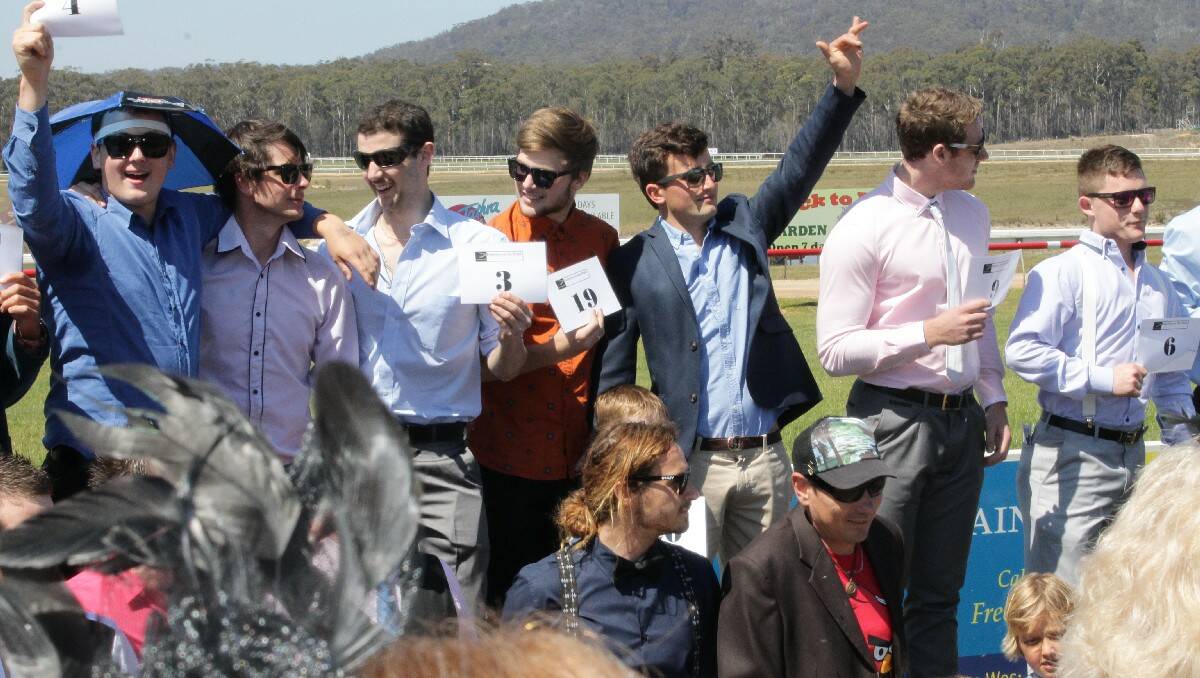 The men line up for Tuesday's Fashions on the Field competition at Sapphire Coast Turf Club.