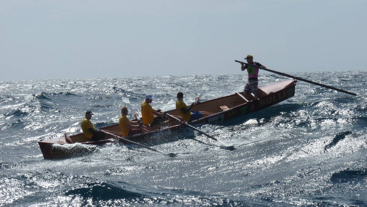 The Bulli men's crew takes on a wave during day five of the George Bass Surfboat Marathon. Photo courtesy of Kimberley Granger.