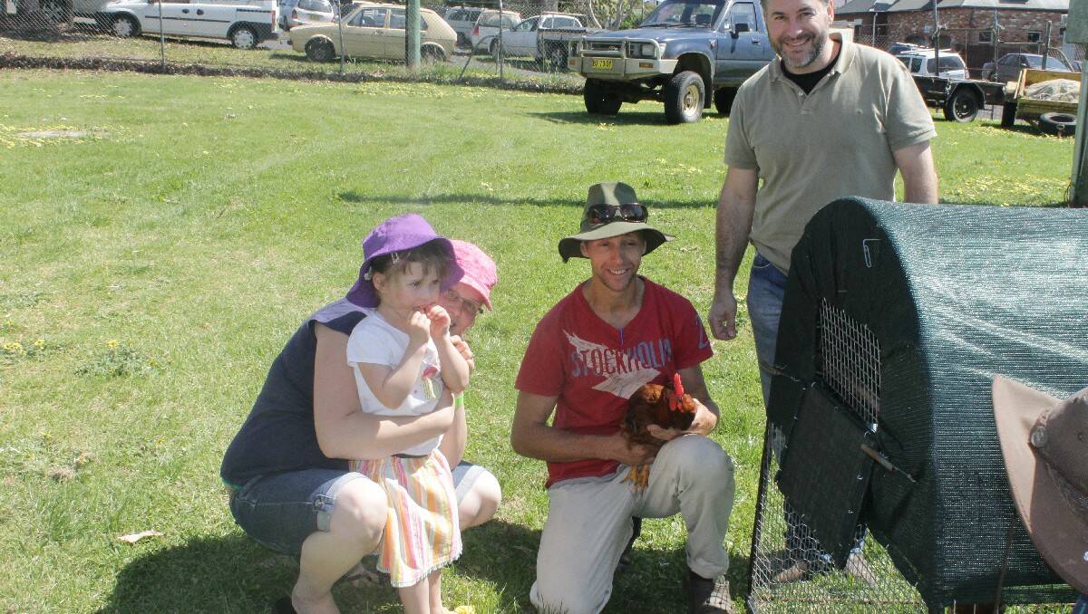 Making a new furry friend are (from left) Alyssa and Emily Gould, Nick van Stekelenburg and Steven Dottori.
