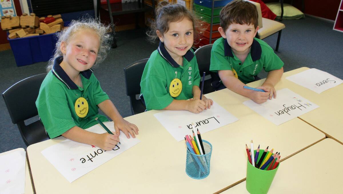 Excited to show off their drawing skills are Bega Valley Public School Kindergarten pupils (from left) Bronte Smith, Laura Slater and Hayden Jackson.