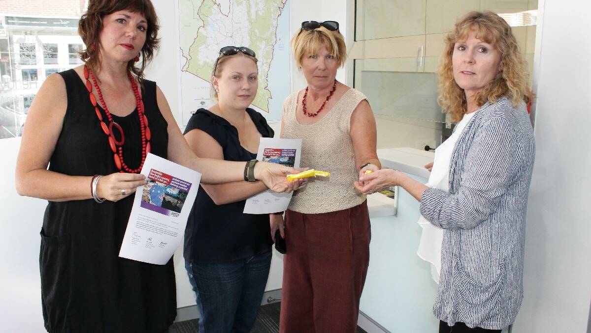 Kirsti Fristad (right) - electoral officer at Member for Eden-Monaro Peter Hendy’s office - is handed sanitary items by Jo Dodds, Jane Blomfield and Mara Roberts. The trio were sending a message about improving conditions for asylum seekers, particularly women.