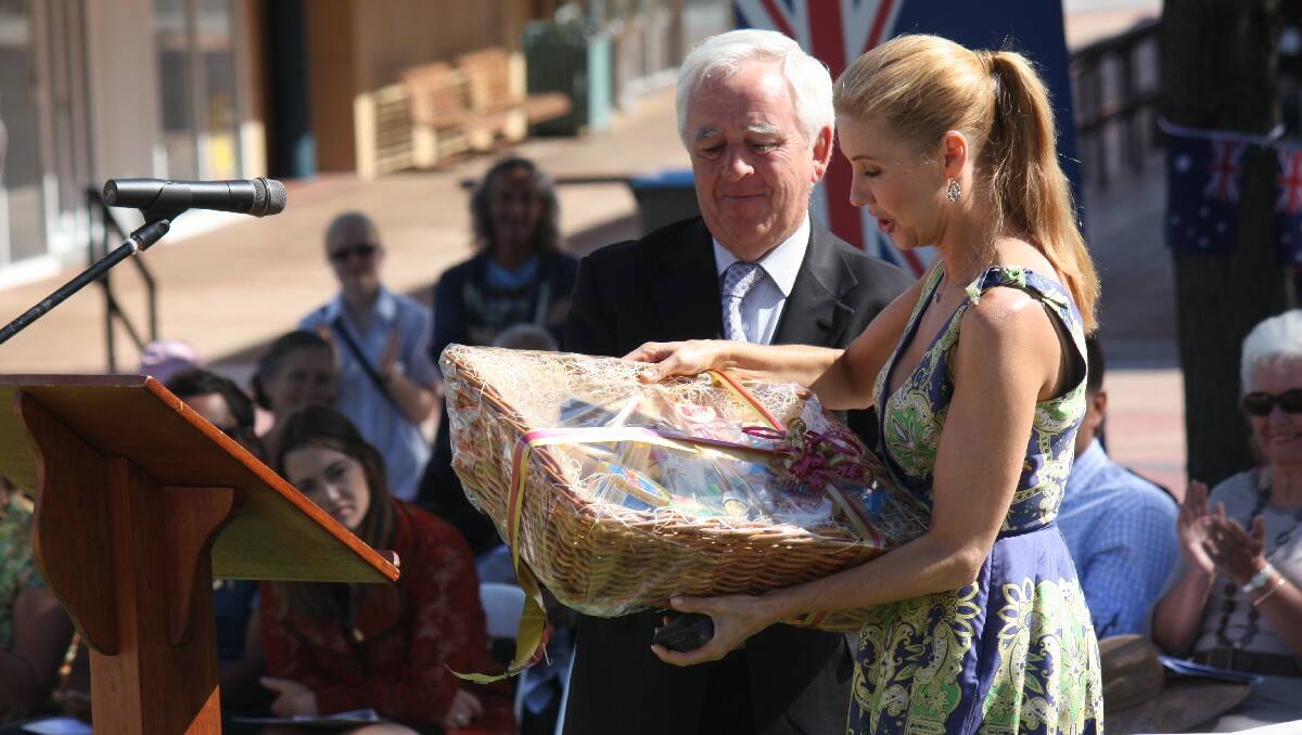 Catriona Rowntree is delighted with a gift of Bega Cheeses presented by Mayor Bill Taylor.