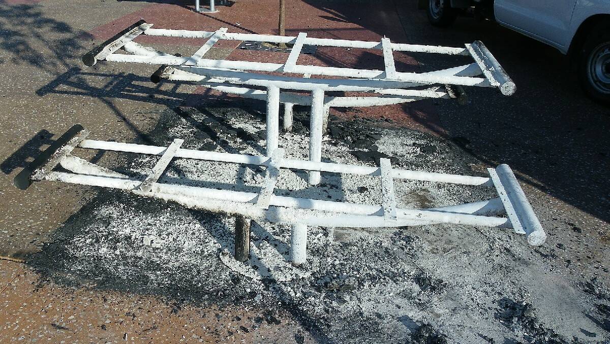 A table and benches in the new Littleton Gardens redevelopment were destroyed in an act of vandalism overnight. Photos: Robert Hayson.