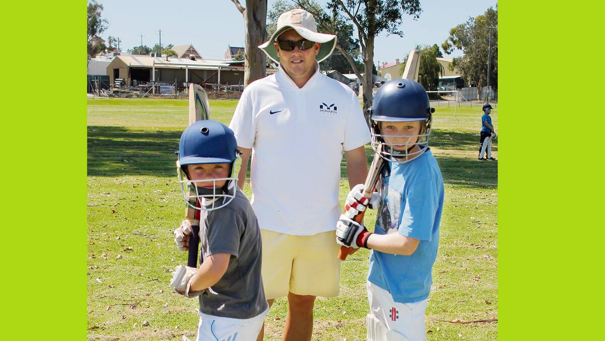 • Former Australian One-Day International player Mark Higgs watches on as Tom Walker (left) and Otis Coyle show off their batting techniques.