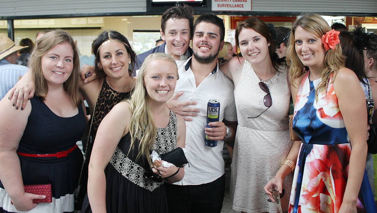 • Taking shelter from the afternoon storm, but enjoying the Boxing Day races at the Sapphire Coast Turf Club are (from left) Hannah Green, Kaycee West, Steph Pearce, Power FM’s JoJo, Johnno Di Donato, Caitlin Johnson and Aimee Hay.