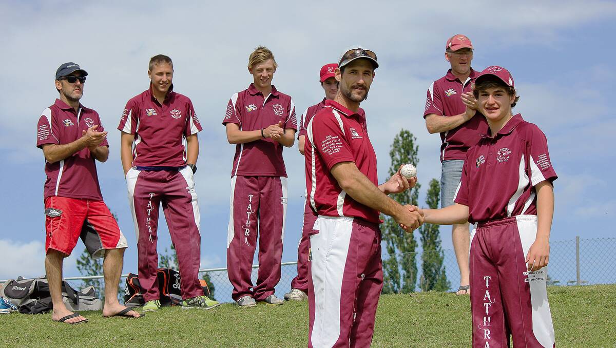 • Team-mates watch on as Tathra’s Lachlan Gordon (right) is presented the game ball by captain Ben O’Reilly after taking six wickets against South Eurobodalla in the first round of the Twenty20 doubler header on Saturday. 