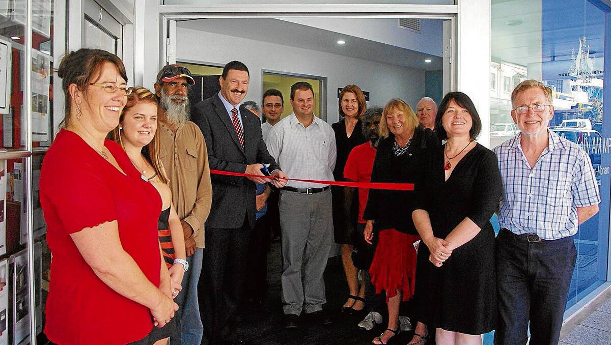 • Federal Member for Eden-Monaro Mike Kelly officially opens the Bega electorate office in Carp Street by cutting the ribbon on Monday. On the right are Leanne Atkinson and Jim Bright, who are staffing the office.