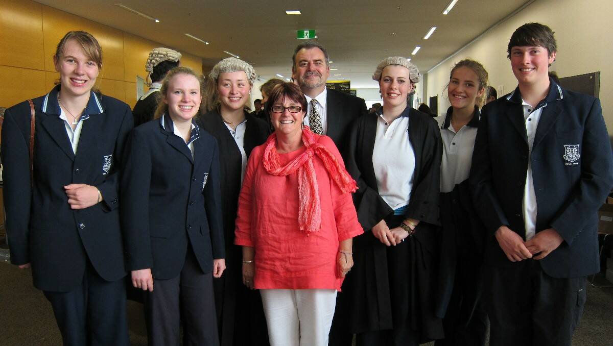 Celebrating Bega High School’s mock trial victory are (from left) Miriam Zweck, Sarah Campbell, Siobhan Ison, manager Denise Perry, coach Steve Clark, Ella Davies, Kiah Carter and Jacob Moore.