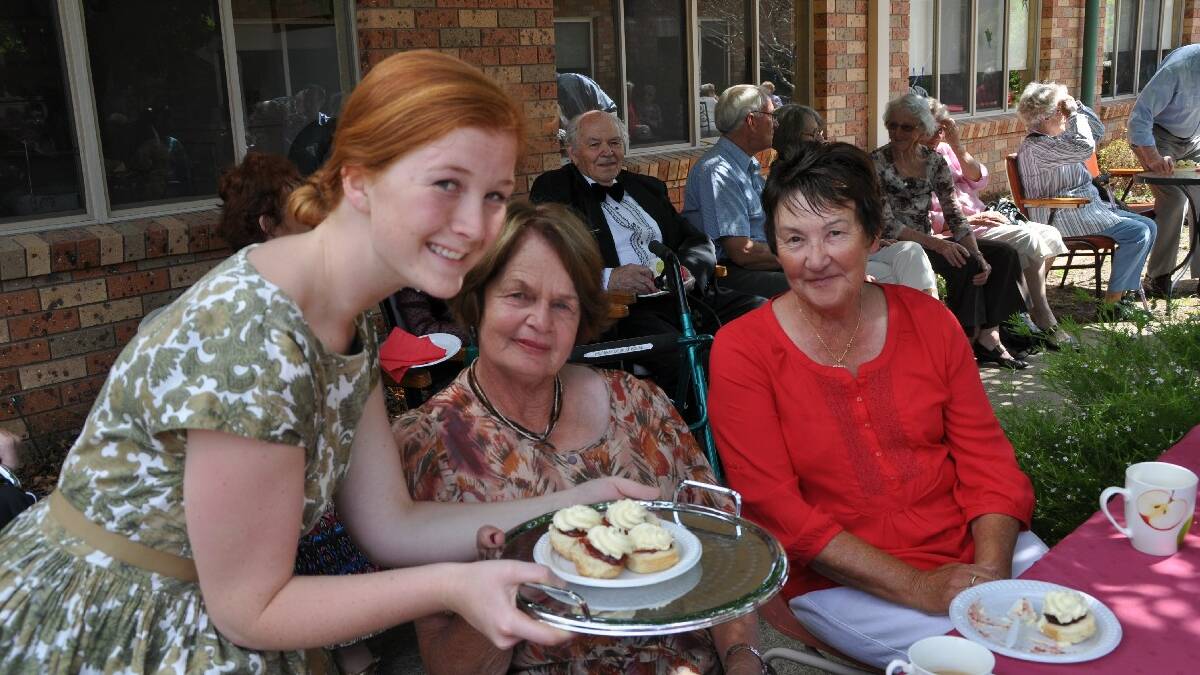 PAMBULA: “I say; anyone for an extra scone with cream?” said Emma Hassan as she topped up the Devonshire tea for Joy Thompson, left and Glenda Graham at the official unveiling   of murals at Imlay House Nursing Home, Pambula.