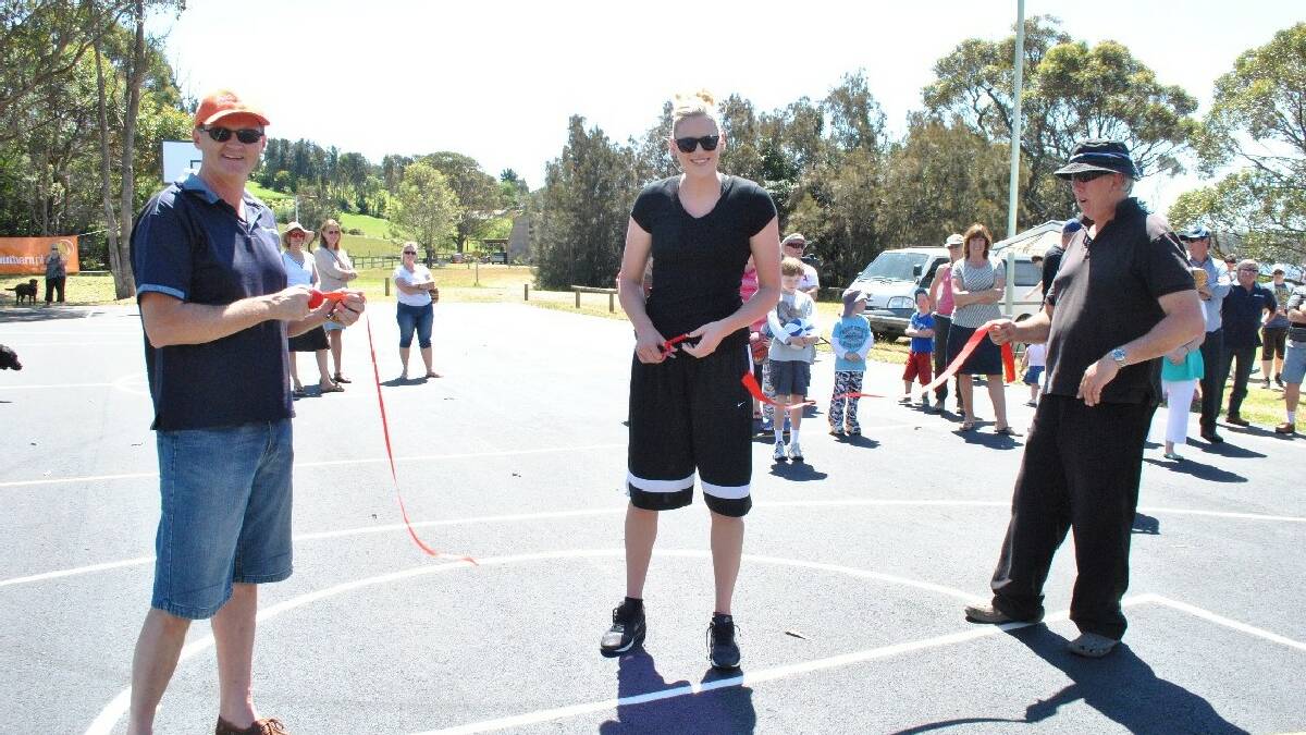 TUROSS HEAD: World champion basketball player Lauren Jackson cuts the ribbon declaring the new Tuross Head basketball court open while Eurobodalla Shire Council mayor Lindsay   Brown holds one end of the ribbon and Tuross Head Progress Association president Lei Parker holds the other end.