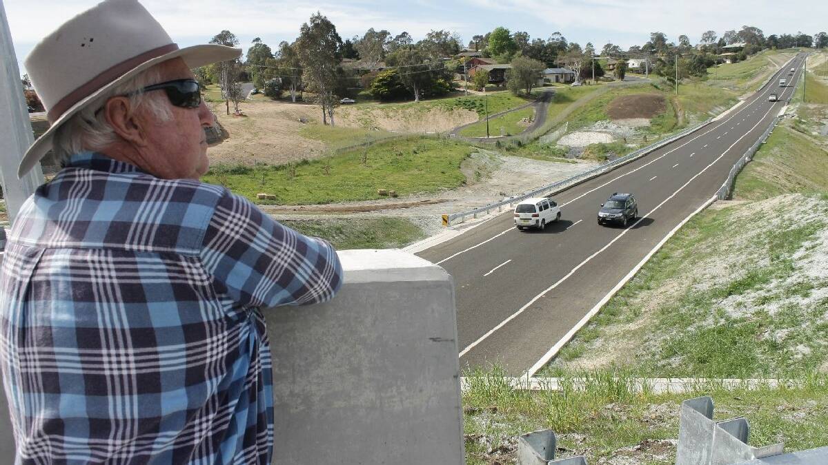 BEGA: Long-time Bega resident Alan Crowe perches above the Bega Bypass on Wednesday morning as it opens to traffic for the first time.