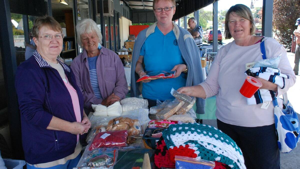COOMA: The Salvation Army held a fundraiser to support its mission in Papua New Guinea with various stalls at its Cooma headquarters. Anita Jaatine, visiting from Finland, and   her friend Mirja Roti from Anglers Reach found some treasures at the craft stall, served by Nancy Bowden and Joy Adams.