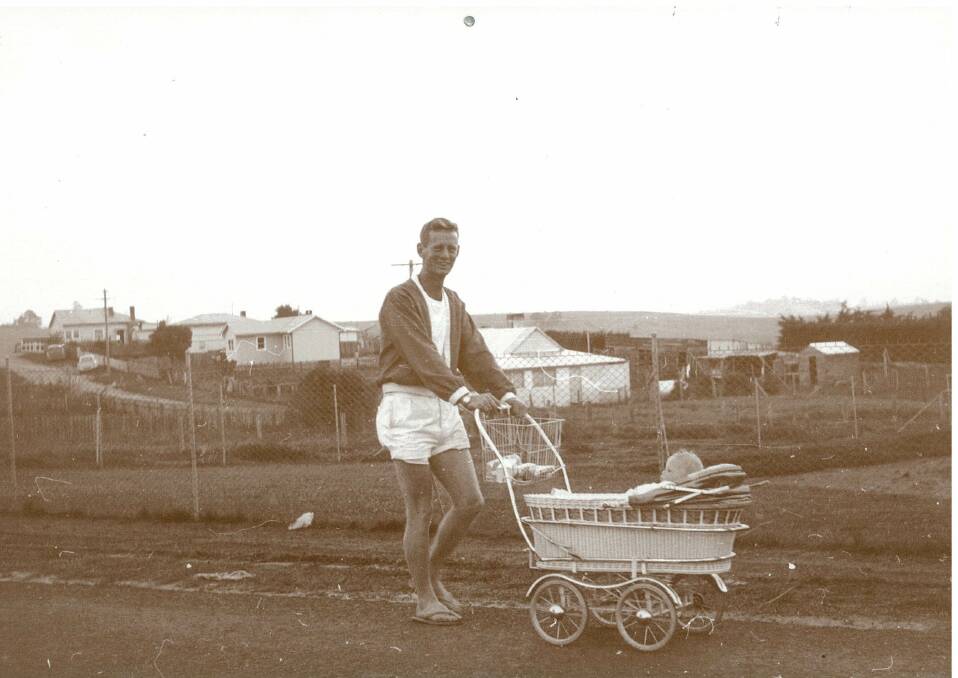 Rowley Williams walking down the Princes Highway, Bega, 1961.