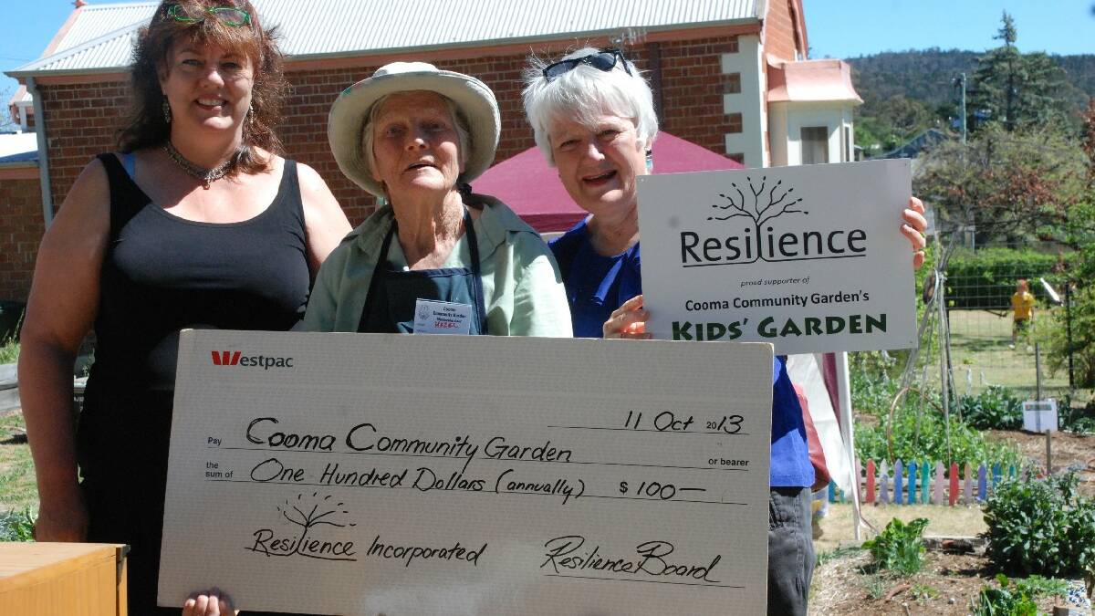 COOMA: Stephanie McDonald and Margo Marchbank from Resilience Inc presented a donation to the Cooma Community Garden, accepted by Hazel McKenzie-Kay, at the Cooma Uniting   Church Fete. At the same venue, the Cooma Garden Club launched its Cold Climate Vegetable Planting Guide.