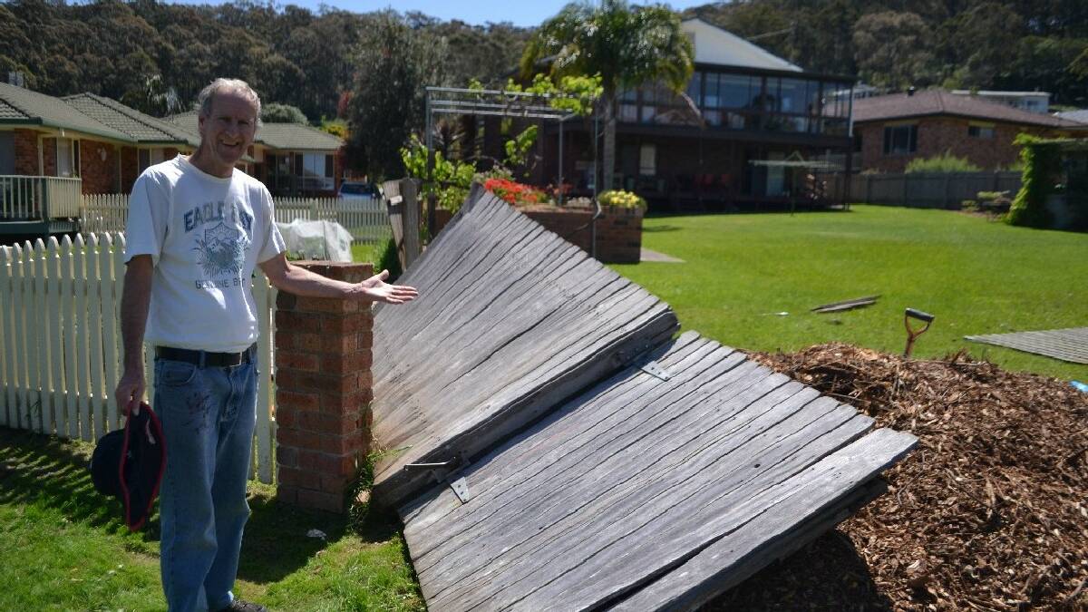 NAROOMA: Homeowner Greg Stockings of Fishermans Crescent, Narooma had his fence blown down by the hot gusty winds at lunchtime last Thursday.