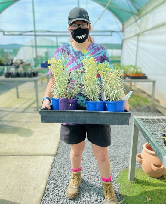 Supported Employee Reece working at Tulgeen Riverside Nursery. All photos supplied. 