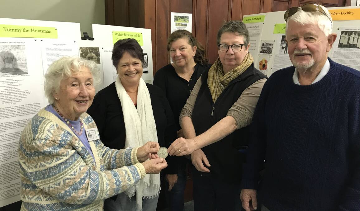 Ursula Hunt (far left) from the Bega Valley Genealogy Society is presented with Andrew Godfrey's medal by Sue Jones, Jennifer Kershaw, Jayne Anne Roebuck and Arthur Godfrey. Photo: Pat Raymond 