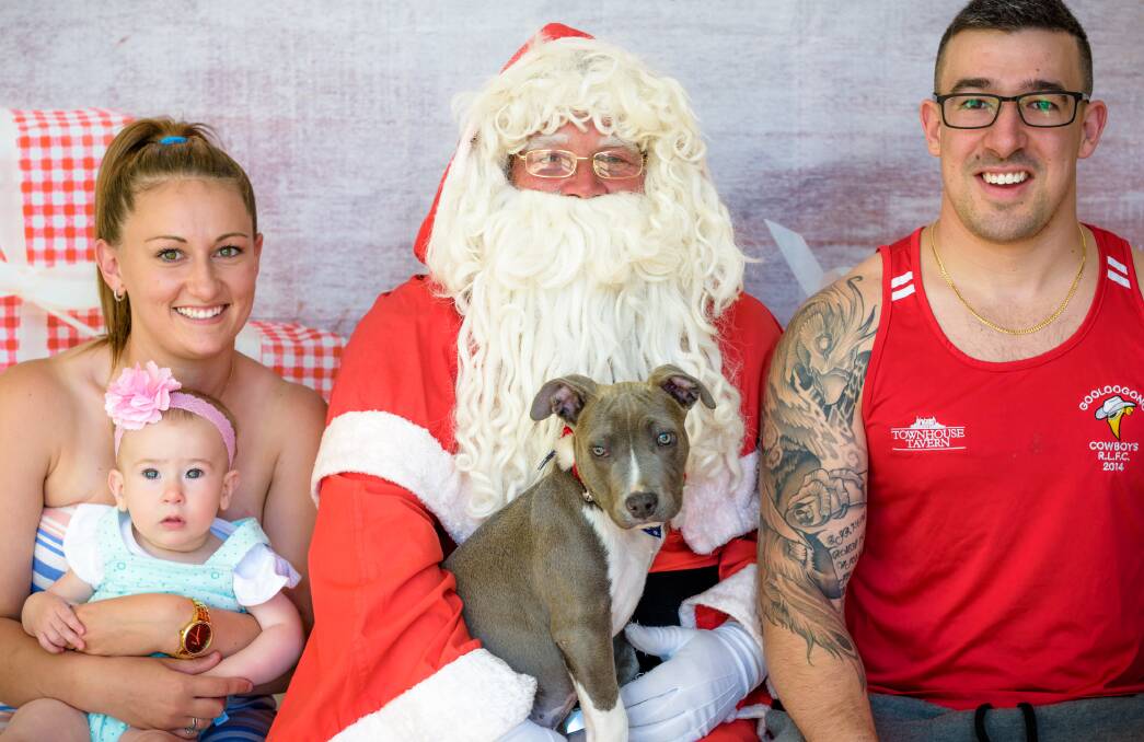 Young Sampson was a little bit nervous about his time with Santa but his family Narelle, Michael and Abbey Forbes were by his side. Photo: Dee Gee's Photography 