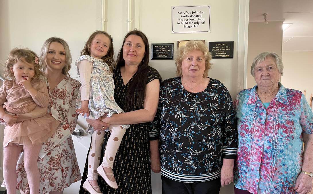 Five generations of the Johnston family came together to put up a plaque for Alfred Johnston who donated the land for the Hall. Left to right: Stephanie and Violet, Leanne and Ruby, Sue and Aileen. Photo: Amandine Ahrens. 