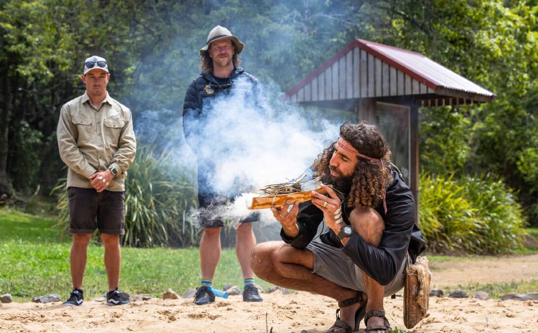 Nathan Lygon conducts a smoking ceremony to begin his cultural tour of Twofold Bay. Picture by David Rogers. 