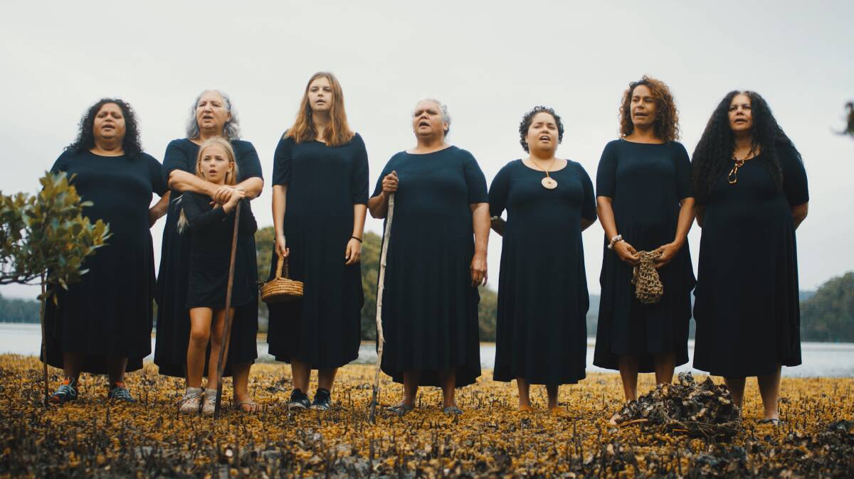  The Djinima Yilaga indigenous women's choir singing at Wagonga Inlet for the third film 'Our way' in the three part film called Bagan, Barra Barra, Mirriwarr. Photo: Andrew Robinson 