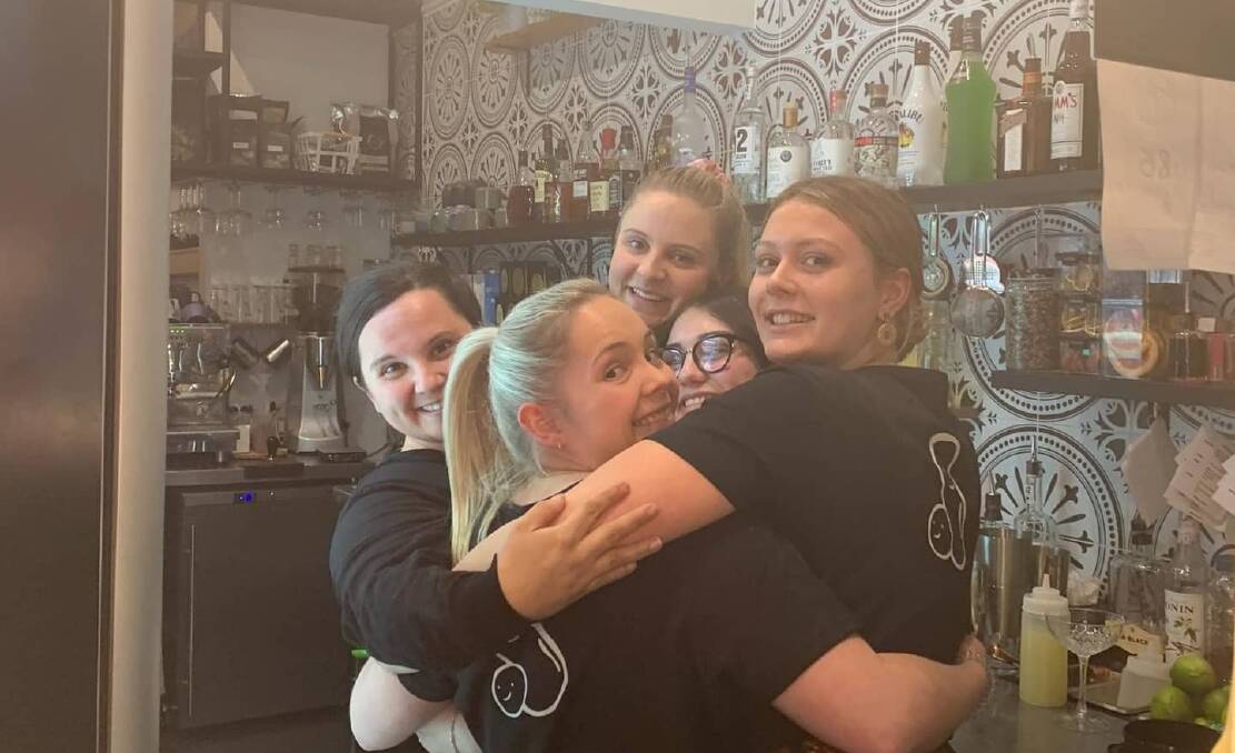 Former owner Katie Rao and her girls getting together for a big team hug at The Peanut Eatery in 2021. Photo supplied.
