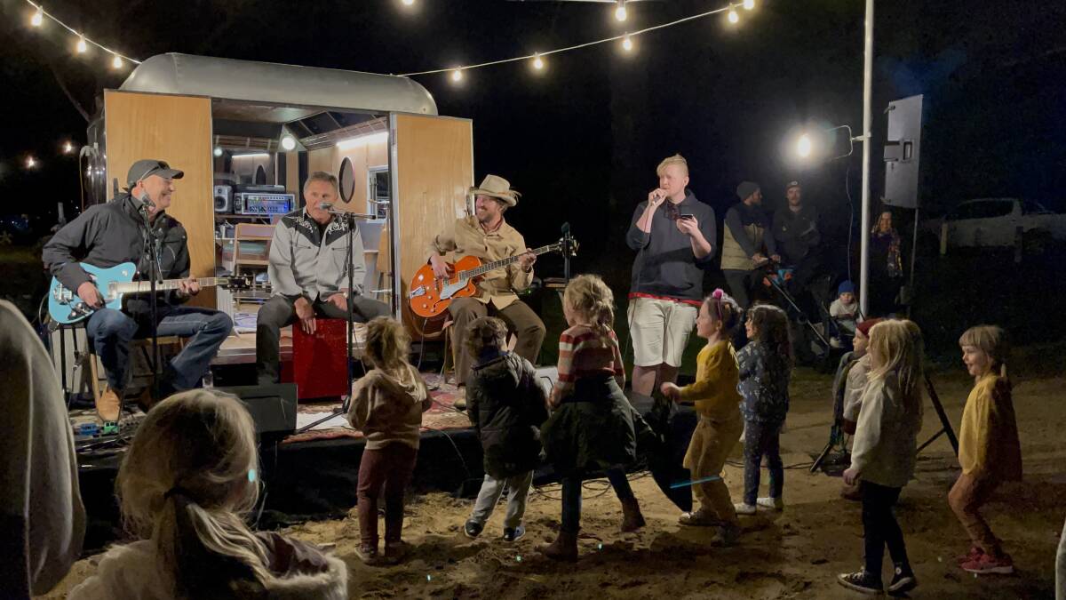 Children dance to music performed by local artists out of Sam's Caravan at the Food Truck Friday event in Tathra, June 2021. Photo: Amandine Ahrens