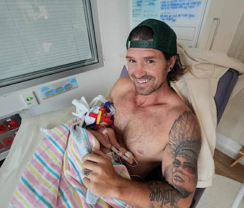 Mick Jessop with his baby boy Ochre at the Centenary Hospital for Women and Children in Canberra. Picture supplied. 