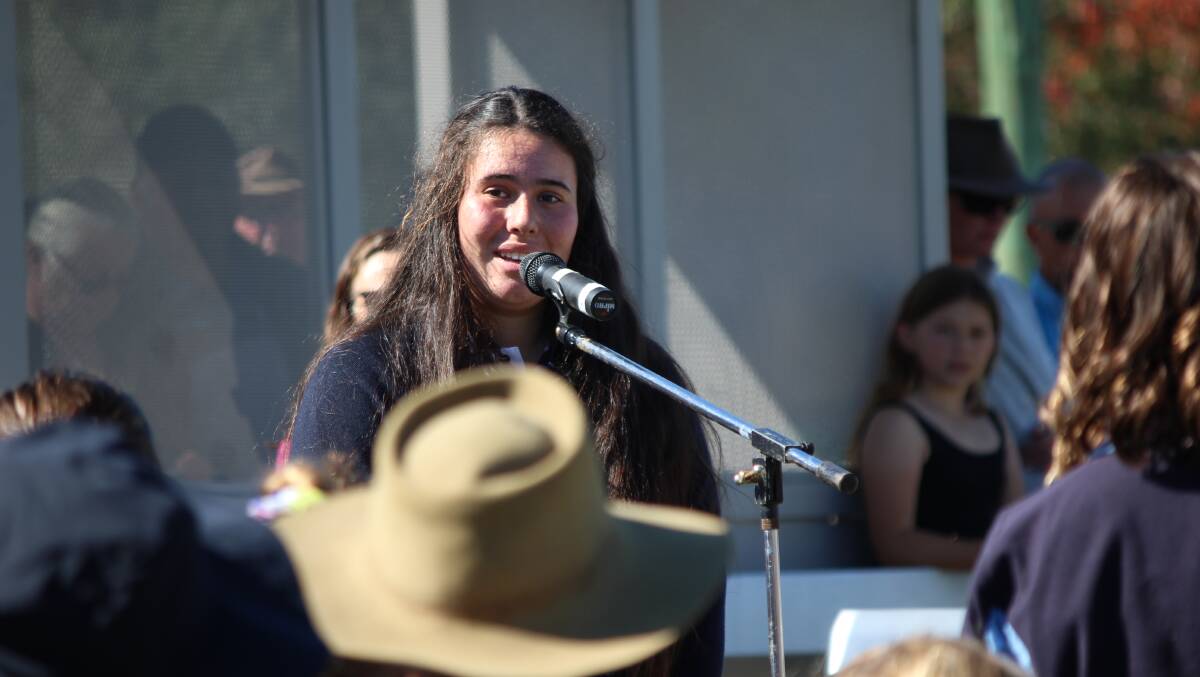 Kataya McCormack singing the New Zealand national anthem in Maori on Anzac Day at Cobargo. Photo: Amandine Ahrens