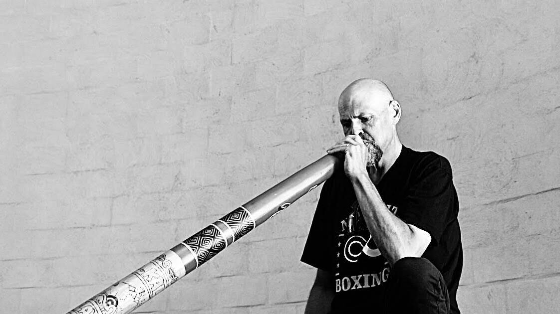 Darren Wighton performs 'Happy Birthday to You' on the didgeridoo for Uncle Ossie Cruse's 90th birthday celebration. Picture supplied. 