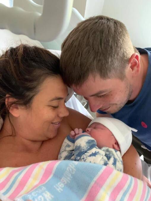 Kelly Young and Brett Goodison with their newly born son Georgie. Photo supplied. 
