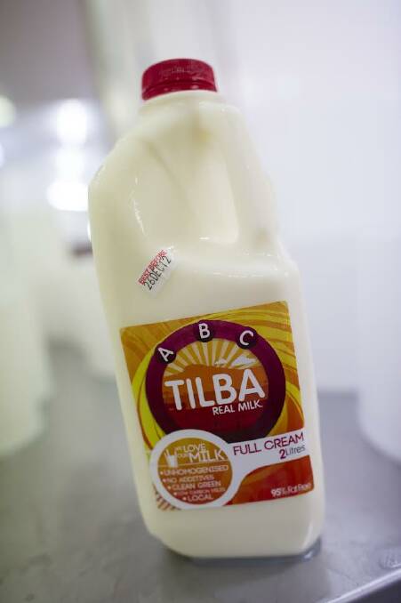 A picture of the Tilba Dairy's very first milk bottle and label. Photo supplied 