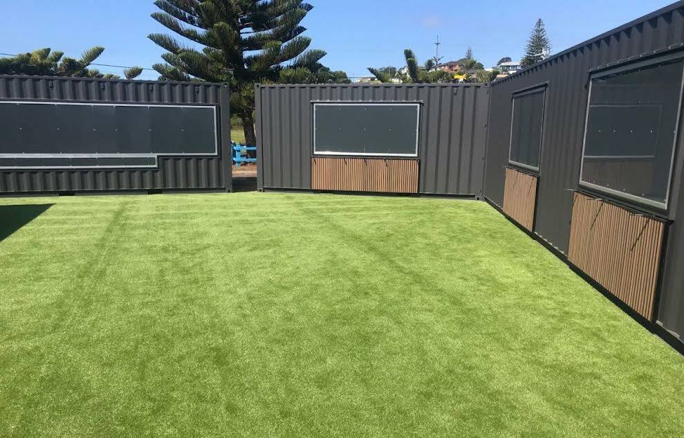 Things are really starting to take shape at Snug Cove with the artificial grass down and the containers in place for Eden's hospitality container venture. Picture supplied. 
