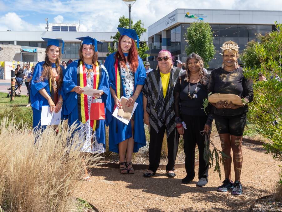 Djiringanj representatives gathered with 2022 UOW Bega's three Indigenous graduates at the Bunaan ring located within Littleton Gardens, Bega. Picture by DoubleTake Photography. 