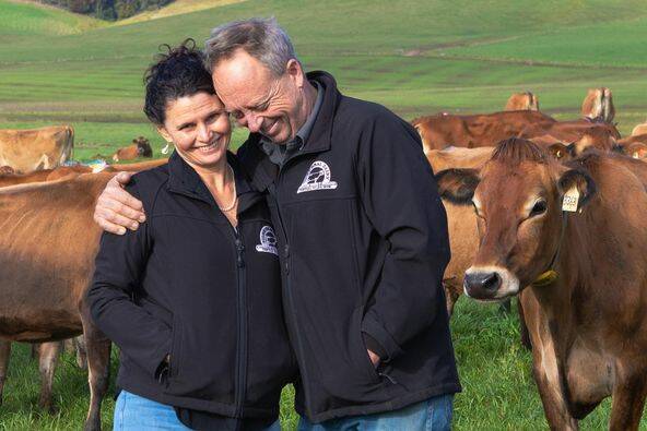 Tilba Dairy owners Erica and Nic Dibden on their farm at picturesque Tilba Tilba, surrounded by their Jersey cows. 