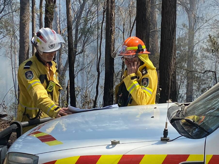 Candelo Rural Fire Brigade captain Phil Banks pictured right, stepped into the role of divisional commander for the Coolagolite fire which broke out on October 3. Picture supplied. 