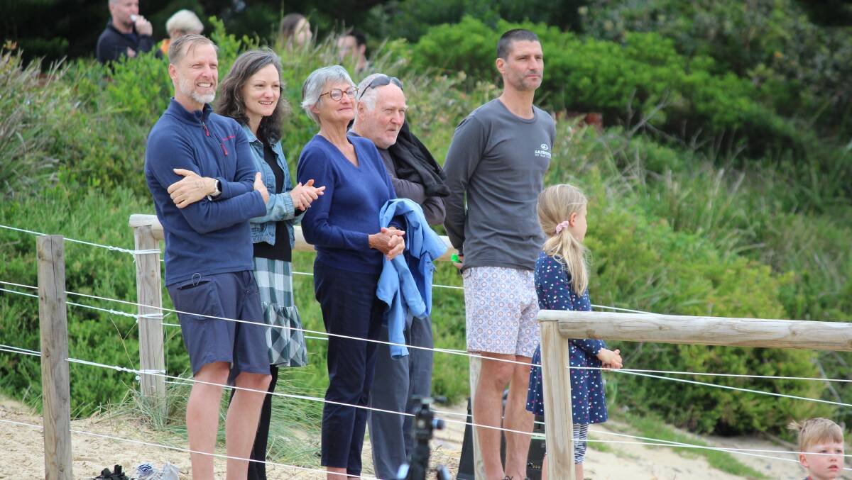 Families onshore cheering the contestants in the ReBoot event swim run swim and point to point swim. Photo: Amandine Ahrens