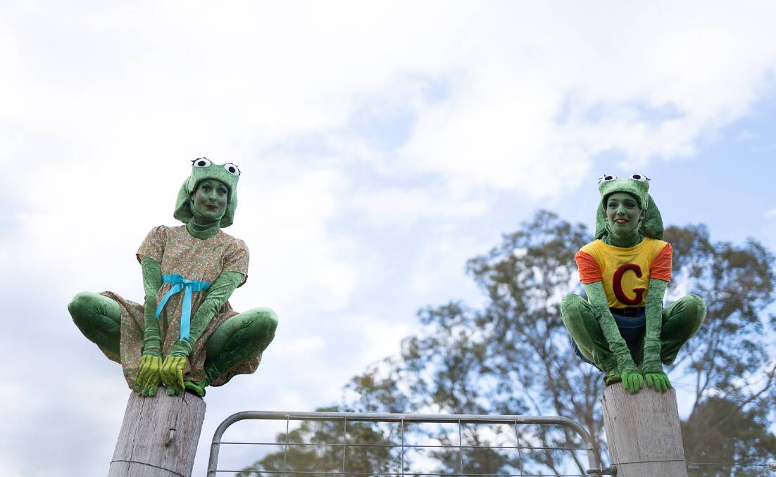 Actresses Aurora Kerth and Charlotte Ahrens, sit perched as frogs in their characters. Photo: Tony Harrington 