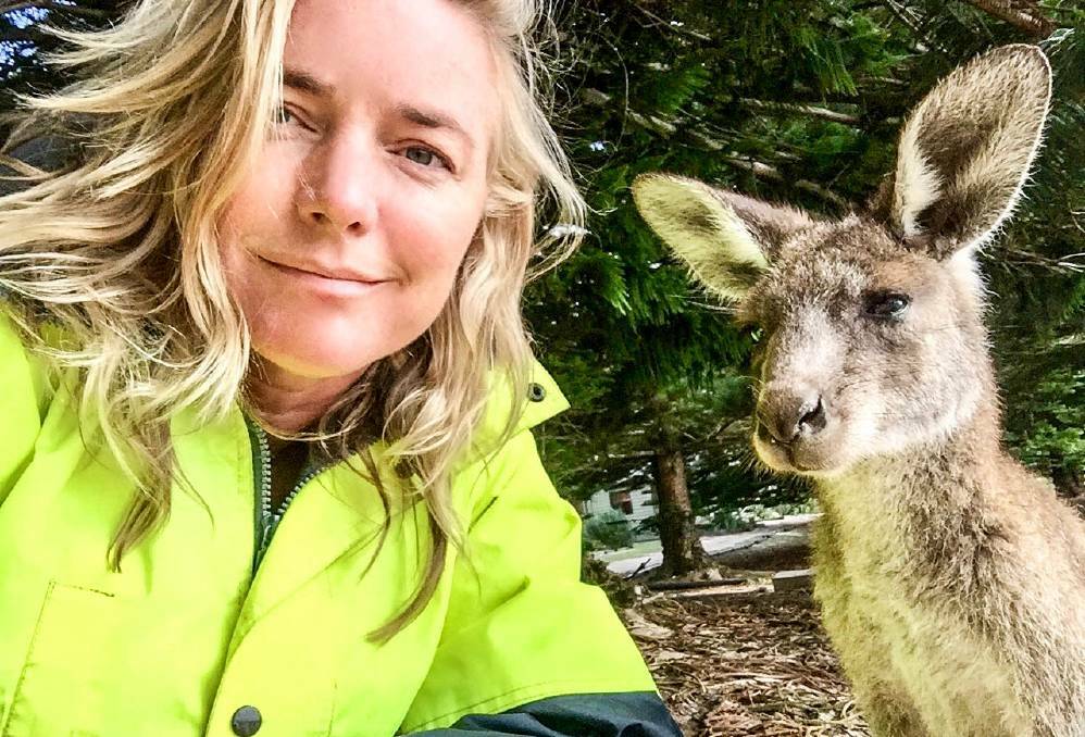 Behind the scenes: Karina Holden takes a selfie with an Eastern Grey Kangaroo while shooting film 'After the Fires'. Photo supplied.