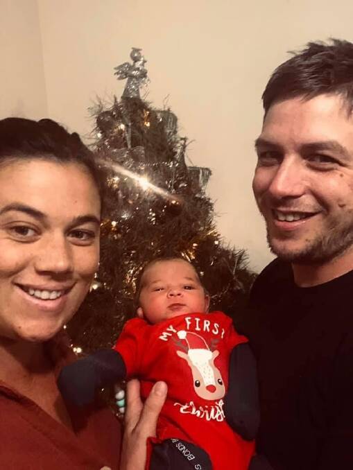 The young couple celebrates their first Christmas with their son Georgie. Photo supplied. 