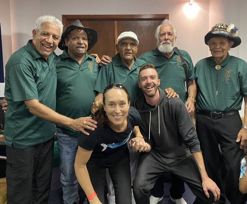 Members of the Giiyong Gum Leaf Band Uncles Ossie Cruse, Ossie Stewart, Herb Patten, James Dungay and Wayne Thorpe gather round filmmakers Toni Houston and Kyle Wilson. Photo supplied
