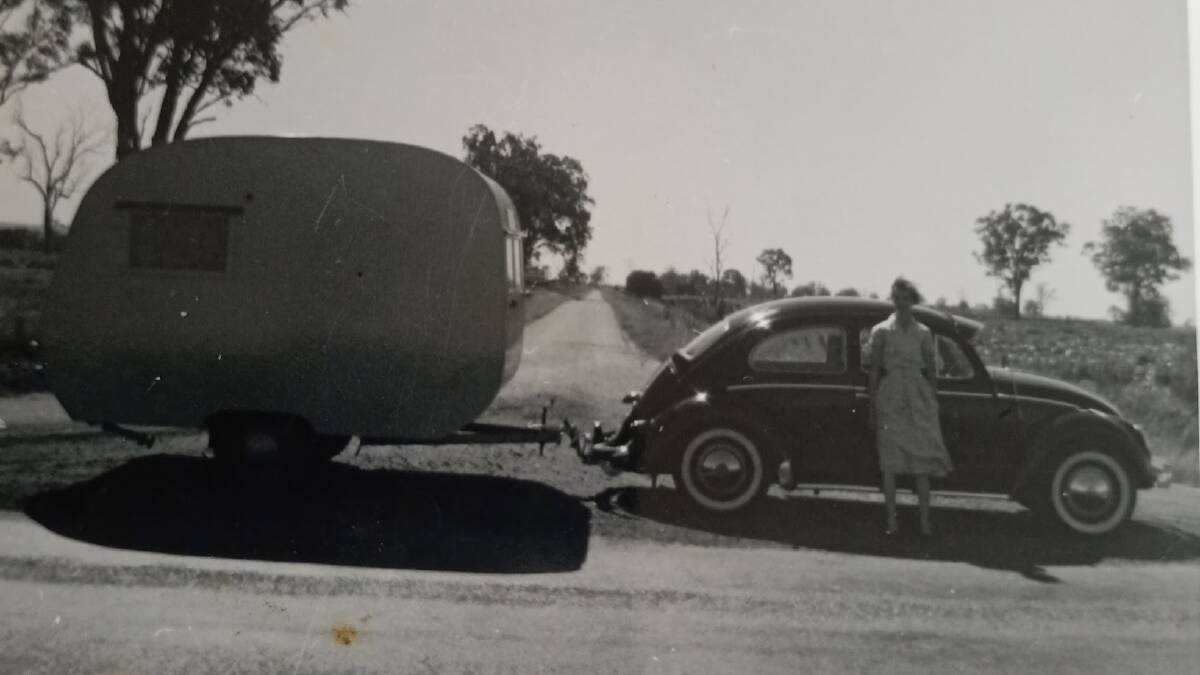 Ron and Joy Smith on a road trip north to Gympie for their honeymoon, in their VW and caravan. Photo supplied