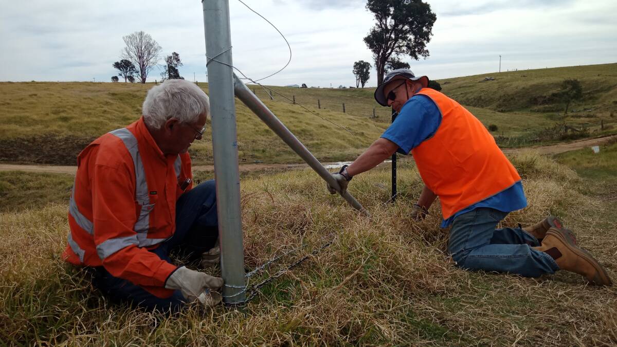 HELPING HANDS: BlazeAid volunteers work to repair fencelines around the district. Photo supplied