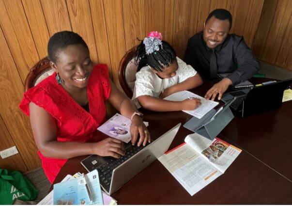 Nwanyi Njoku and her family engaged in their volunteer activity of writing to others about their Bible-based hope. Photo supplied.