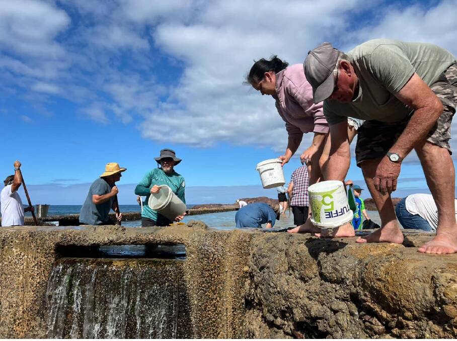 Community members from across the Bega Valley attend the big sand scoop out event at Aslings Rock Pool on Saturday February 24. Picture supplied.
