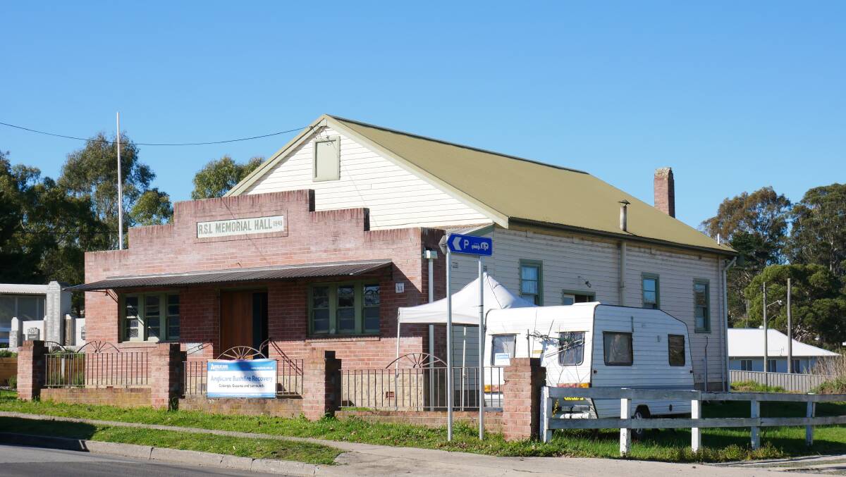The RSL Memorial Hall with the Anglicare caravan set up to the right of the building. 