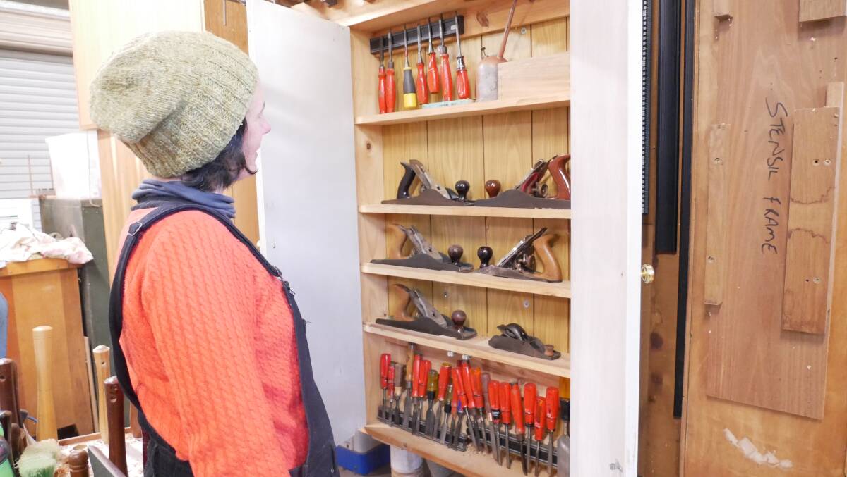 Sarah Davis checks out the tool library available at Woodies. Photo: Ellouise Bailey