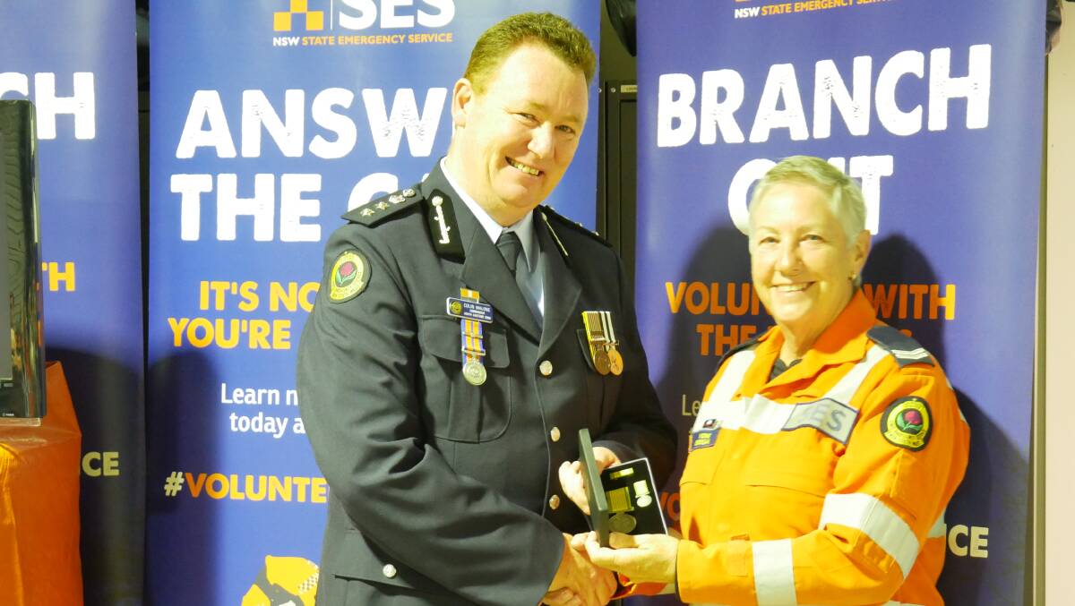 South Eastern zone commander Colin Malone and award recipient Jannetje Burrell. Photo: Ellouise Bailey 