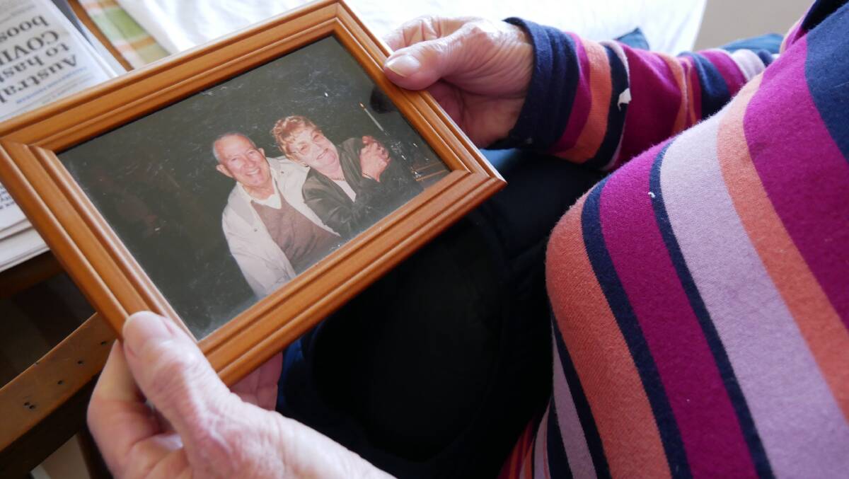 A picture frame taken down from the shelf that was dusted off to show an early memory of the couple together. Linda said she particularly loved this photo of them. Photo: Ellouise Bailey