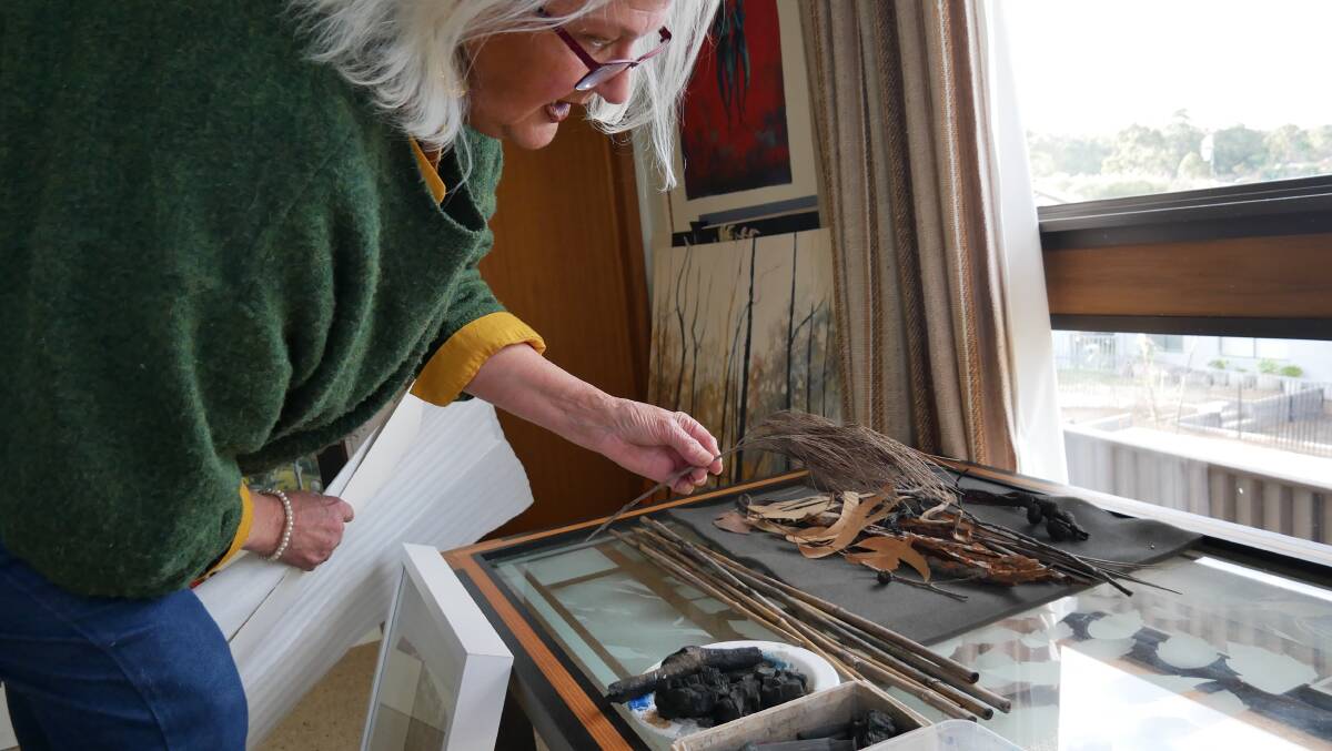 Ms Lindhorst shows some of the items she has collected from the bush to use to complete her paintings. 